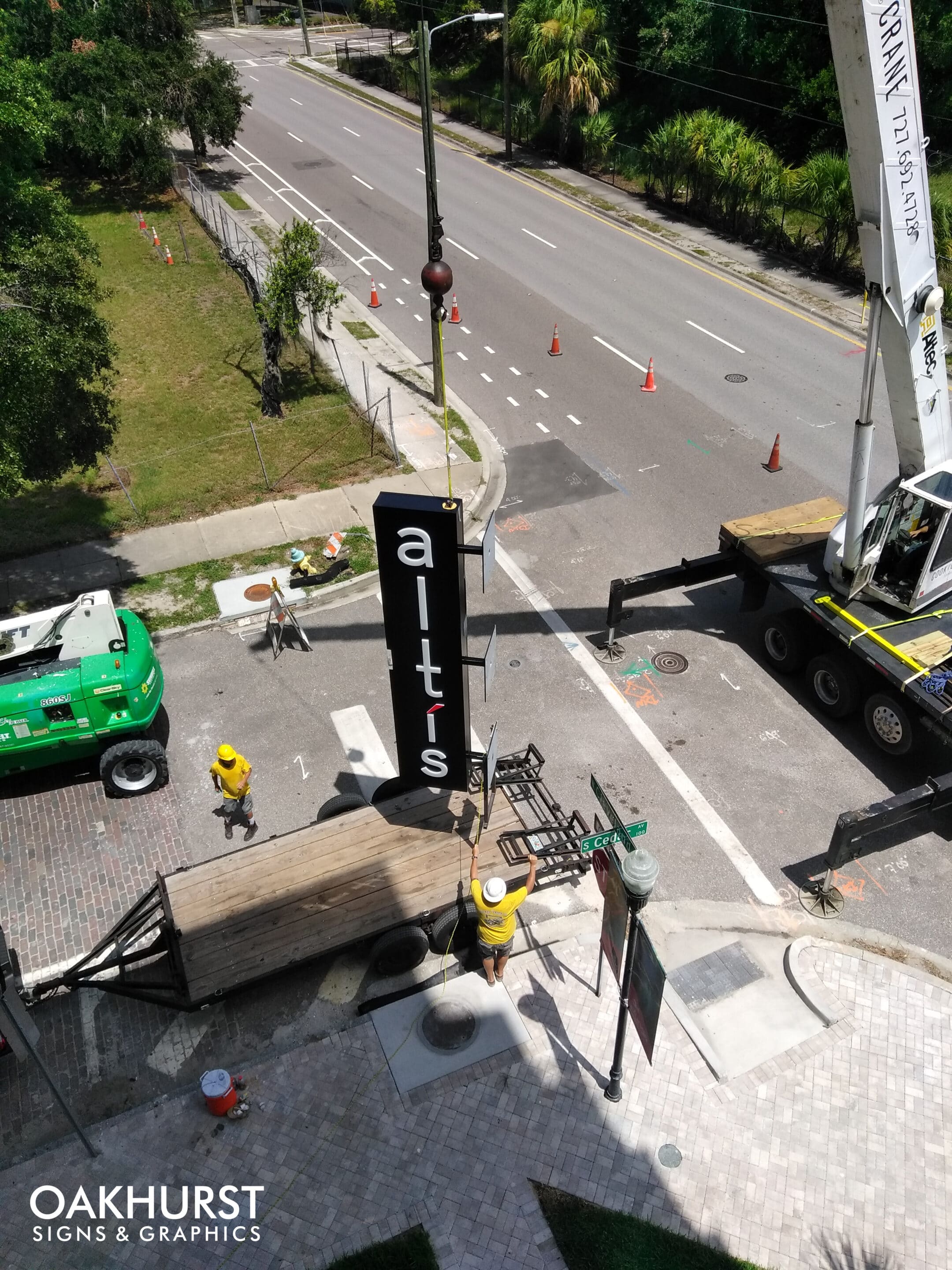 Altis Blade Sign being lifted for installation