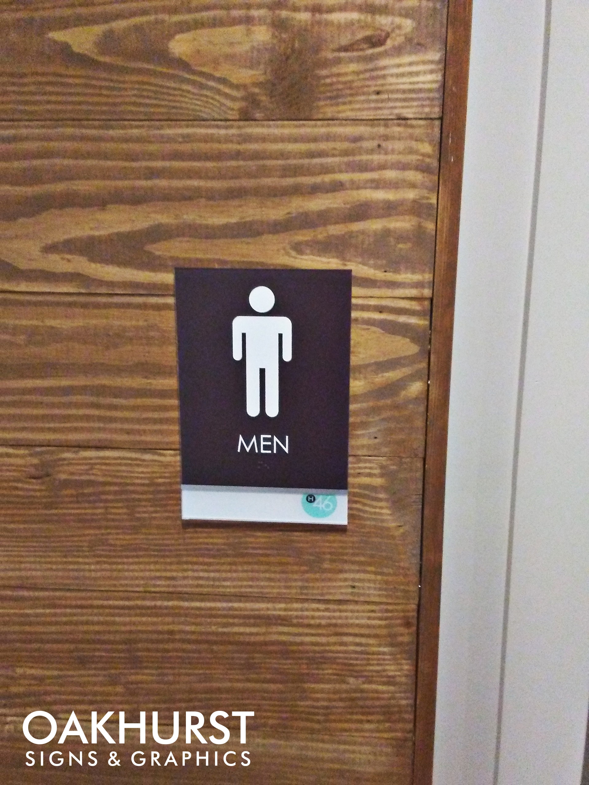 ADA signage labeling men's room