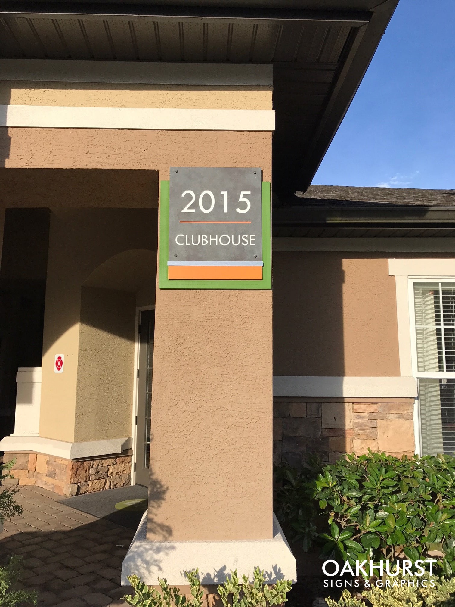Clubhouse label exterior wayfinding sign